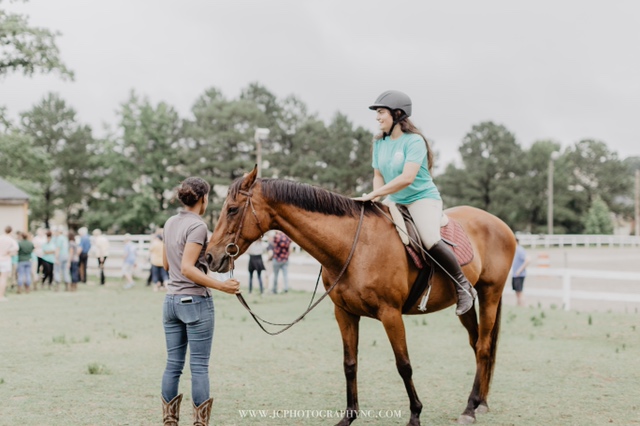 CORRAL girl getting an equine-assisted pyschotherapy session