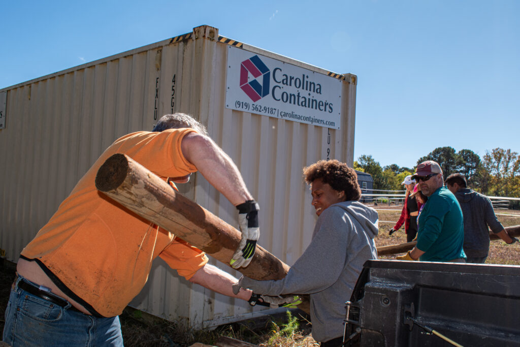 Volunteers working during Fall on the Farm.